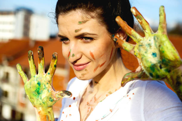 istock Young woman have a fun with colors 665472924