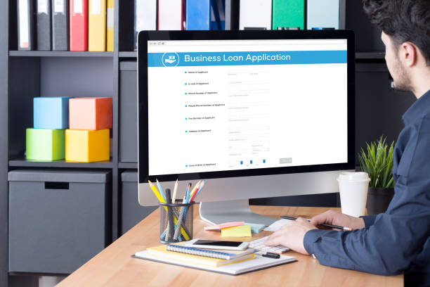 istock Businessman filling Business Loan Application form on Internet 665473056