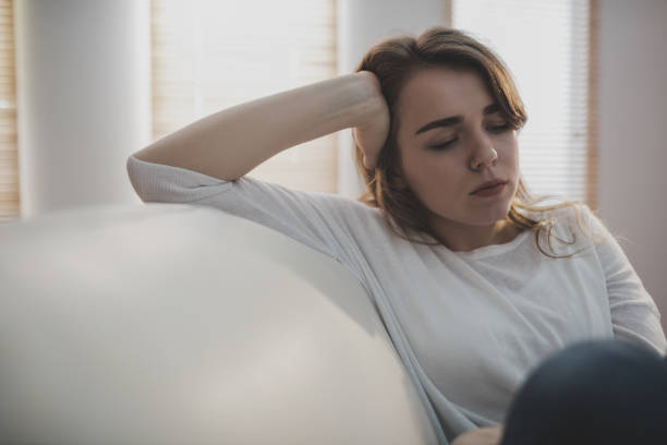 istock Upset woman sitting on the couch 665490358