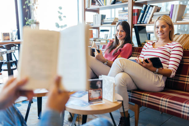istock Friends reading books and studying for exam together 665490400