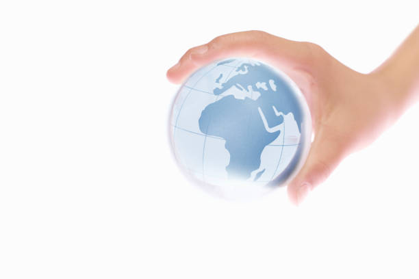 istock Child's hand and the Earth 665498414