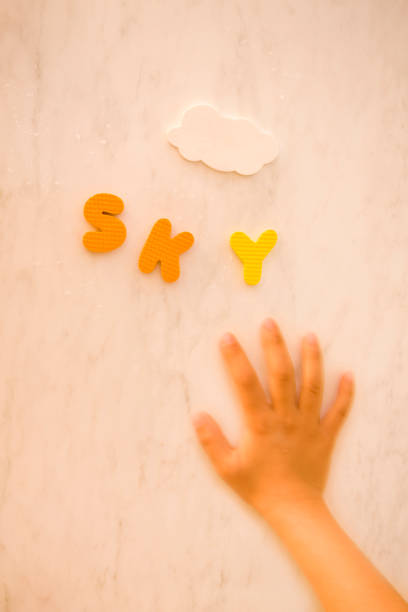 istock Child's hand and alphabet 665499758