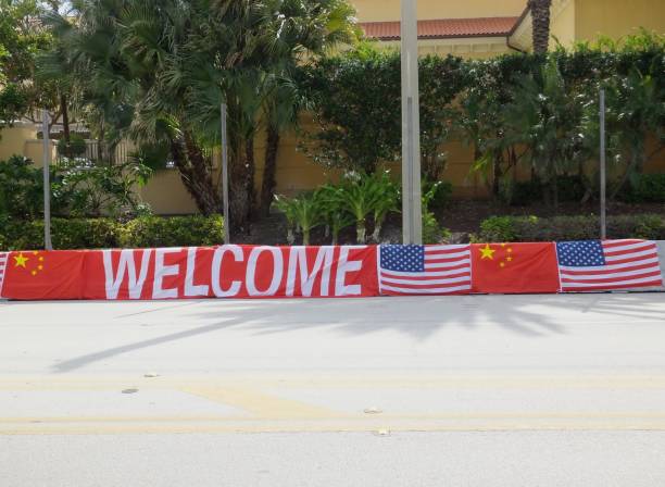 Welcome China! The Chinese President Xi Jinping visit to West Palm Beach, Florida for a two-day summit on April 6 & 7, 2017 with President Trump. He’s staying at the Eau Palm Beach Resort and Spa in Lantana.  Lined on both sides of the road are Welcome signs with the Chinese and USA flags located in front of the hotel which will have fencing for protection. xi jinping stock pictures, royalty-free photos & images