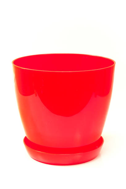 istock Red plastic flower pot isolated on white 665506464