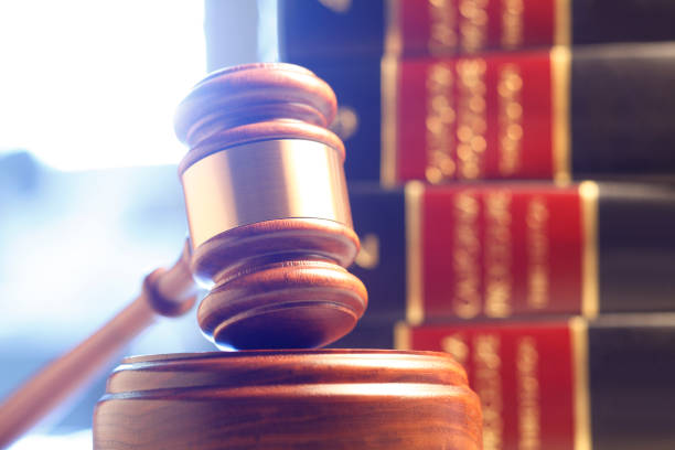 istock Gavel Resting In Front Of Stack Of Law Books 665515228