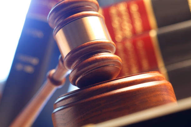 istock Gavel Resting In Front Of Stack Of Law Books 665515262