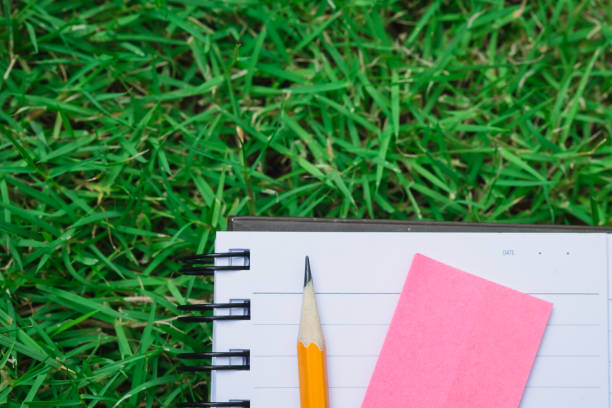 istock simple task list reminder on nature green field 665524316