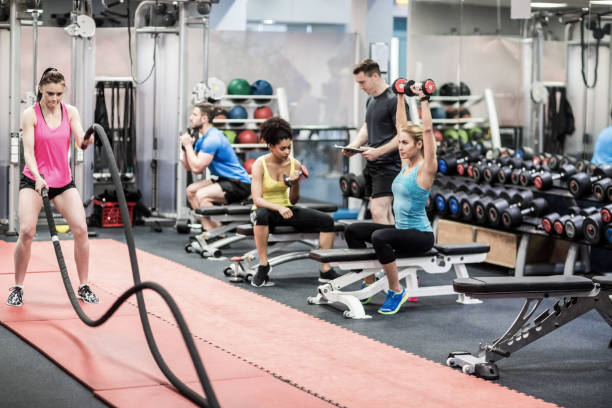 istock Fit people working out in weights room 665529166