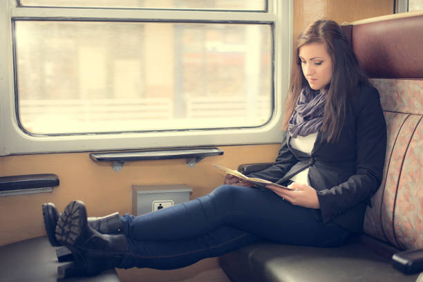 istock Pretty student woman sitting on the train 665531800
