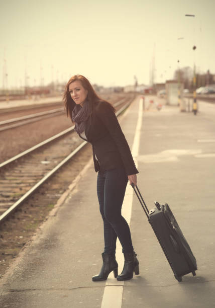 istock Pretty woman waiting for a train 665531816