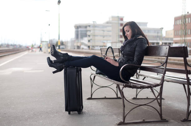 istock Young traveler woman waiting for a train 665531940