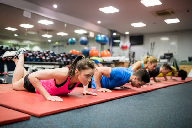 istock Fit people working out in fitness class 665536174
