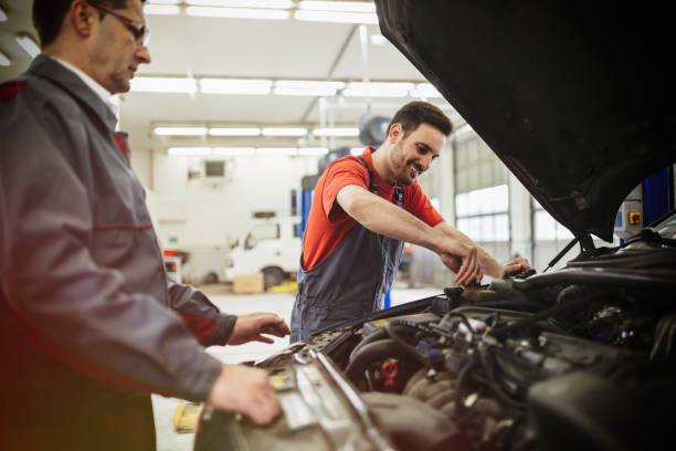 istock Car mechanics working on car maintenance 665544826