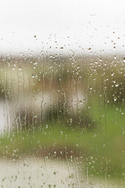 istock Raindrops on glass, spectacular color background 665545322