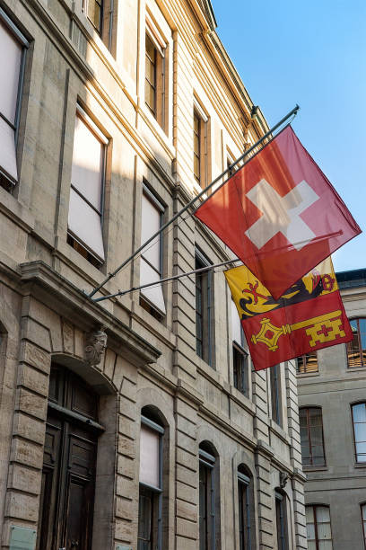 istock Flags on Place Taconnerie in Geneva old town 665552210