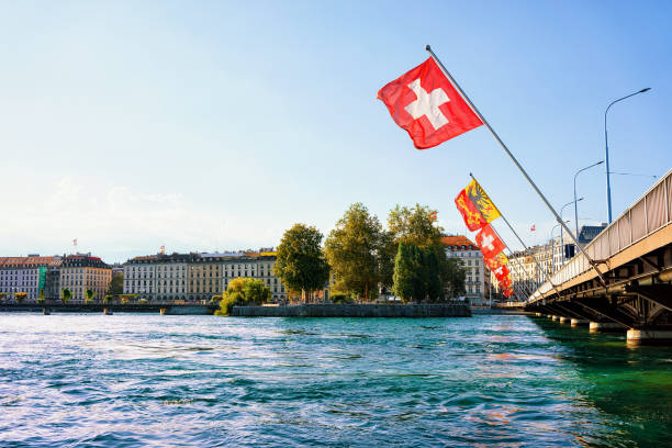 istock Geneva Lake with Mont Blanc bridge and many flags 665552558