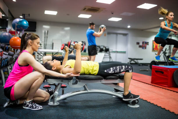 istock Fit people working out in weights room 665555540