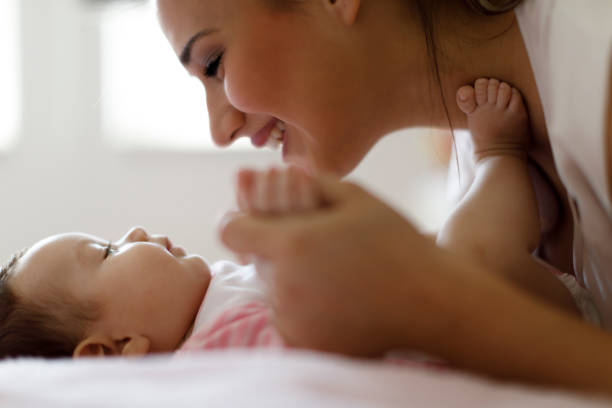 istock Mother playing with her baby at home 665555664
