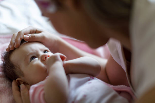 istock Baby and mother at home 665560380