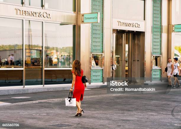 Woman In Red Dress Going To Tiffany Store In Geneva Stock Photo