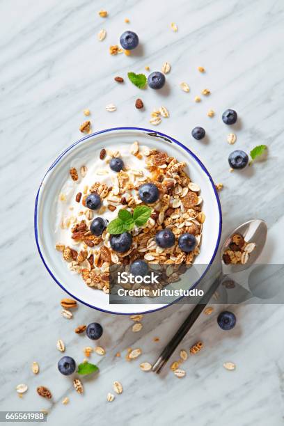 Cereals Breakfast With Blueberries On A Marble Background Healthy Morning Meal With Fresh Berries Top View Stock Photo - Download Image Now