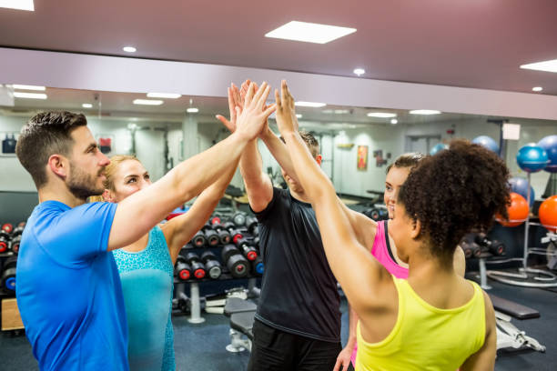 istock Fit people putting their hands together 665564158
