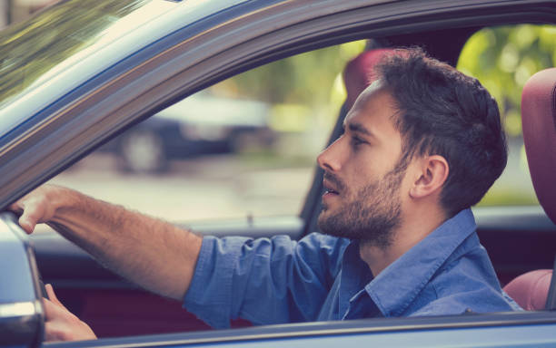 istock Young man driving in the modern car 665573976