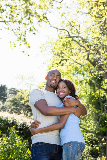 istock Couple embracing in the park 665574990