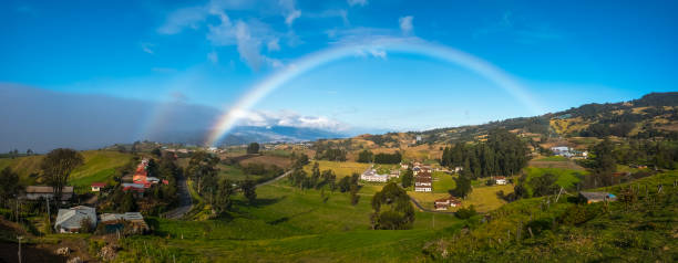 View from slope of volcano of Irazu Green meadows and rainbow. View from slope of volcano of Irazu to the valley. Costa Rica irazu stock pictures, royalty-free photos & images