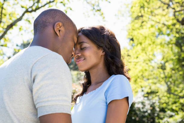 istock Couple standing face to face in the park 665578012