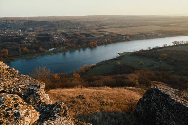 istock Two banks of the river at sunset 665578862
