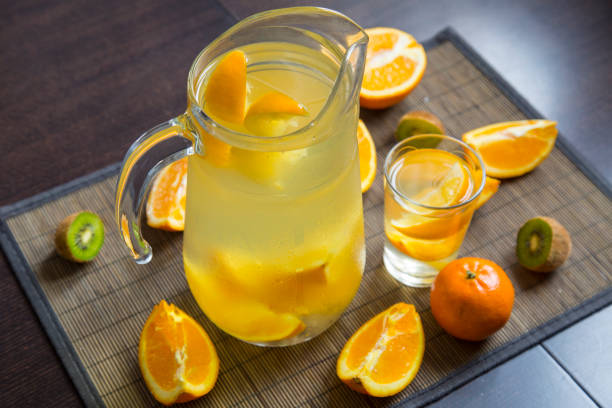 istock Glass jar with a home-made lemonade and fruits 665581258