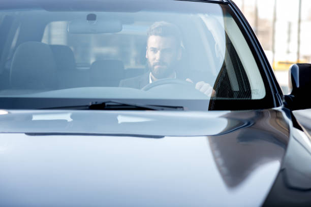 istock Businessman driving a car 665581274