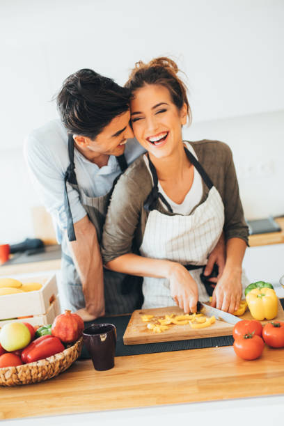 istock Young couple cooking in the kitchen 665582492
