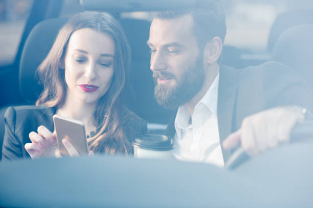istock Business couple in the car 665584730