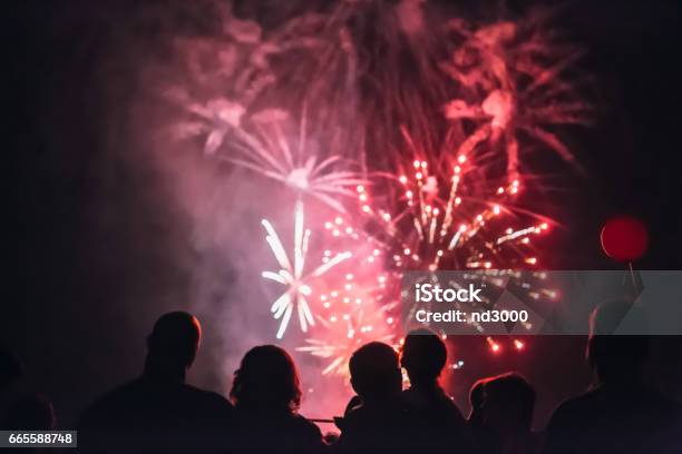 Crowd Wathcing Fireworks And Celebrating Stock Photo - Download Image Now - Anniversary, Bright, Celebration