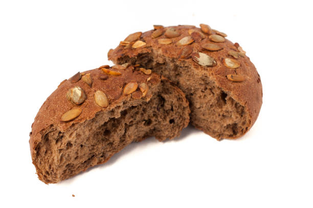 istock round a bun with pumpkin seeds wherein is isolated on a white background 665589776