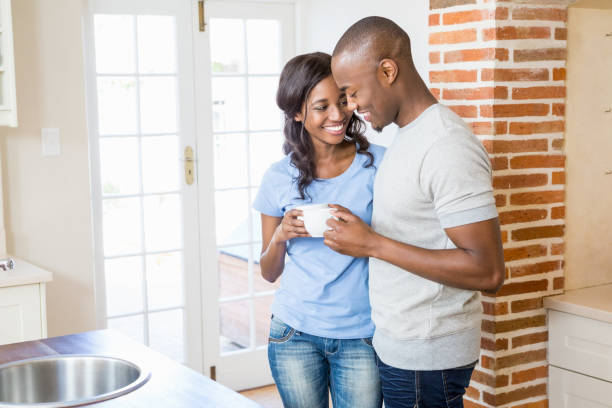 istock Young couple holding coffee mug 665589842