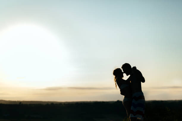 istock Couple dancing during sunset at summer resort 665593114