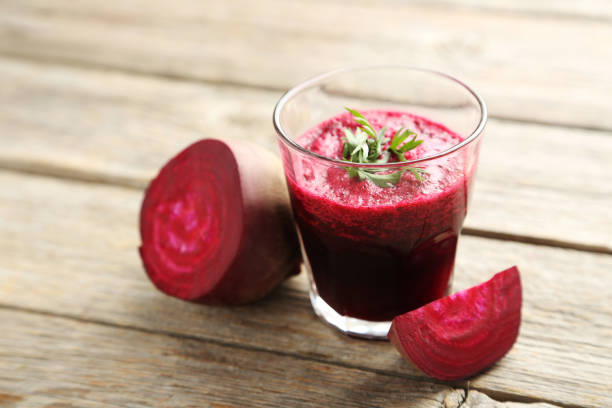 istock Fresh beets juice in glass on a grey wooden table 665593218