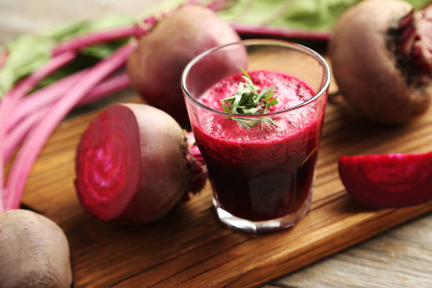 istock Fresh beets juice in glass on a grey wooden table 665593778