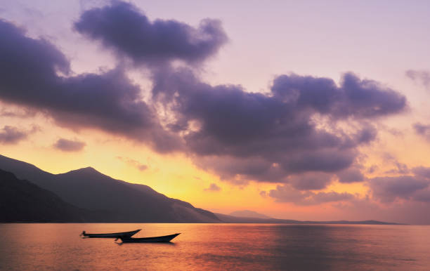 Evening seascape with boats in Socotra island, Yemen. stock photo