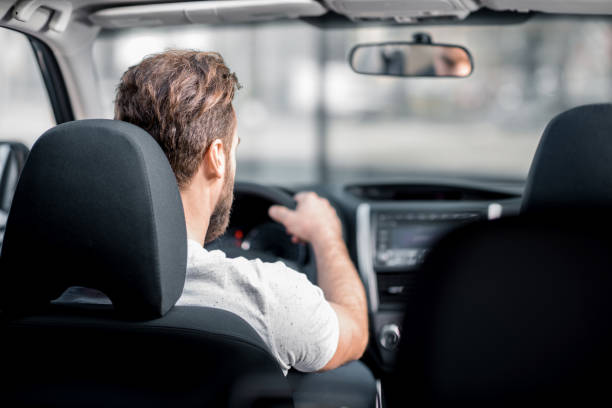 車を運転する男 - owner women car rear view mirror ストックフォトと画像