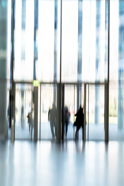 istock Blurred People at the Door 665606964