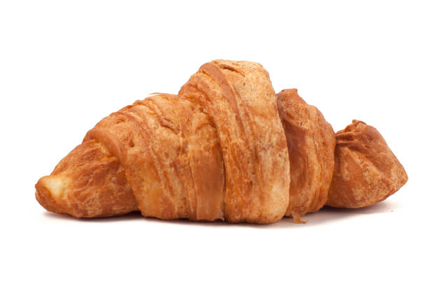 istock Fresh and tasty croissant over isolated white background 665607174