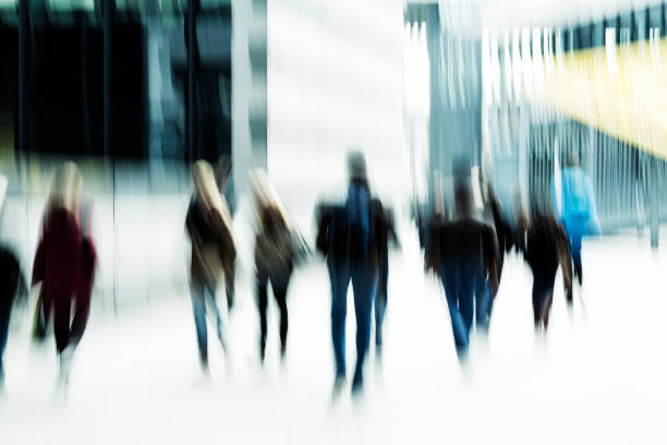istock Blurred Business Commuters Walking in Financial District 665609244