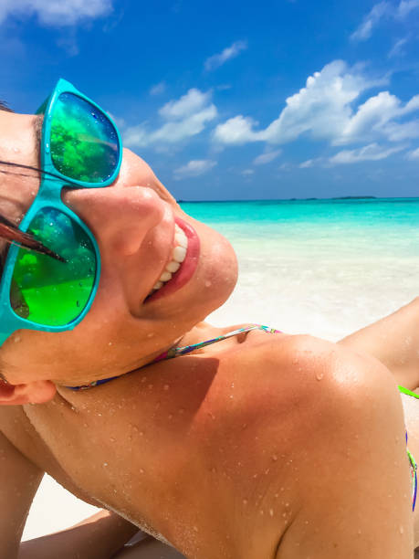istock Close Up Attractive Woman  Relaxing On The Beach 665613832
