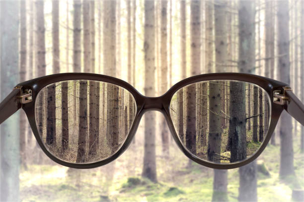 istock Clear cityscape focused in glasses lenses with blurred background 665614274
