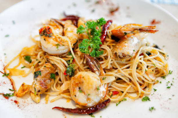 istock Garlic and oil spaghetti with spicy shrimpgg 665622852