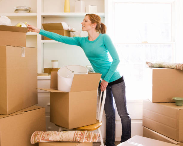 istock Young couple with surrounded by moving boxes. 665623380